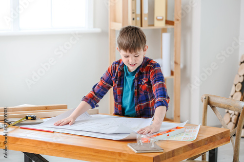 Cute little builder with dr...