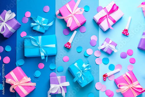 Many Birthday gifts and decor on color background