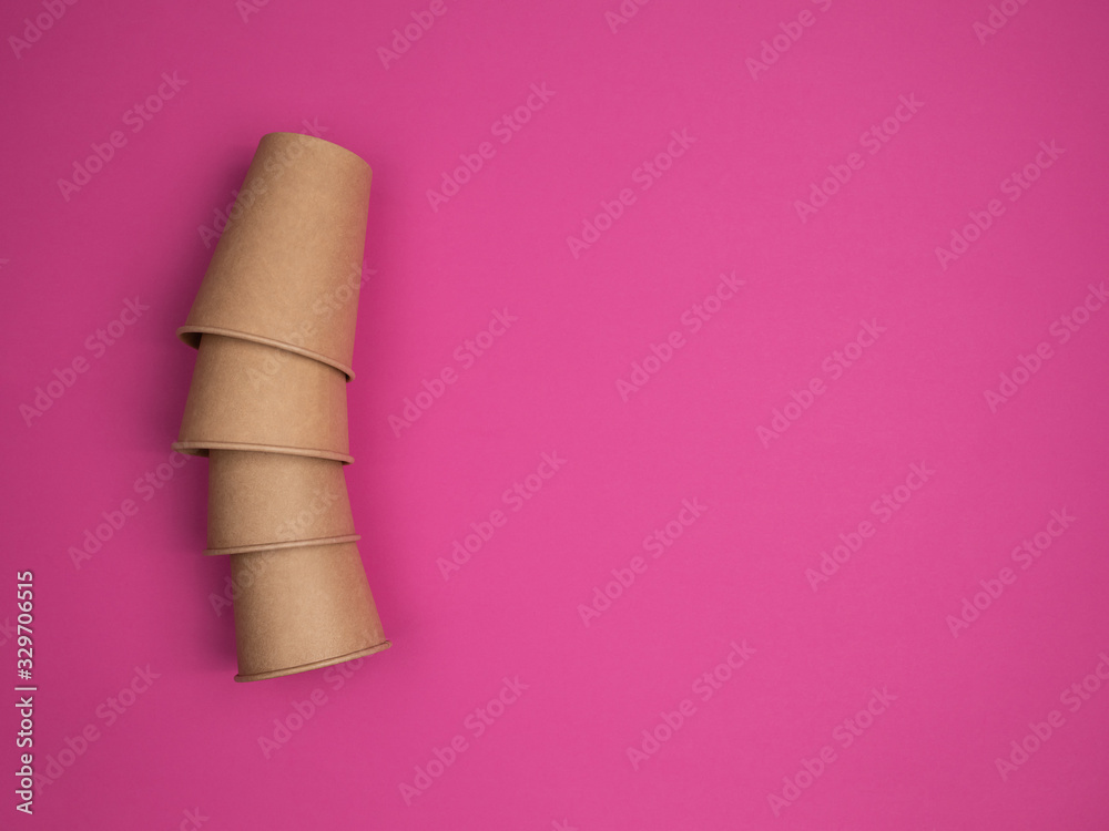 Eco Kraft paper utensils on a pink background. Eco Kraft paper utensils on a pink background.