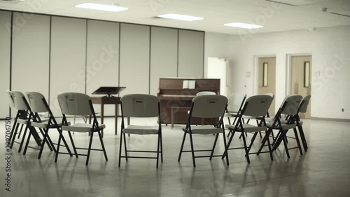 Church Fellowship Hall Chairs Gathered In Circle Around Piano Close Up