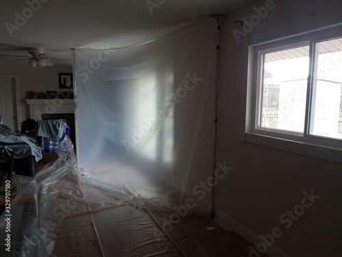 plastic or containment area in home or house with windows photo