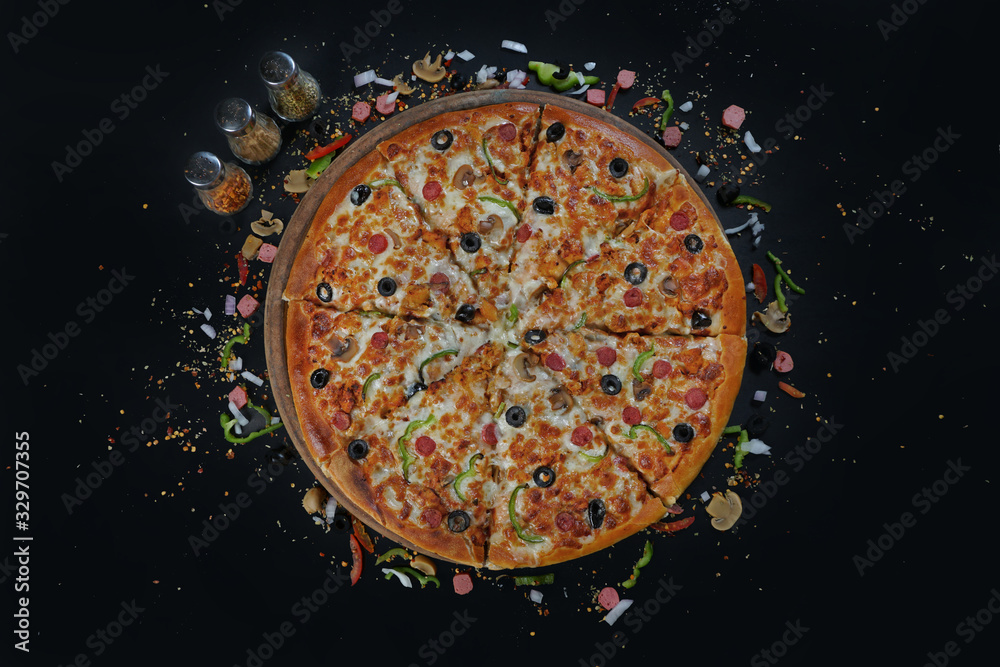 Top view of Pizza with Sauces on black board