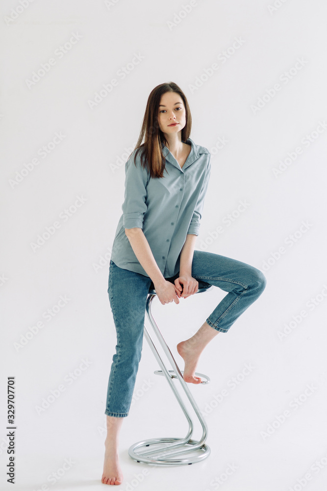 Professional model and pose at the cyclorama. Model tests of a girl in a Studio with a white background. Professional model and pose at the cyclorama. Model tests of a girl in a Studio with a white background.