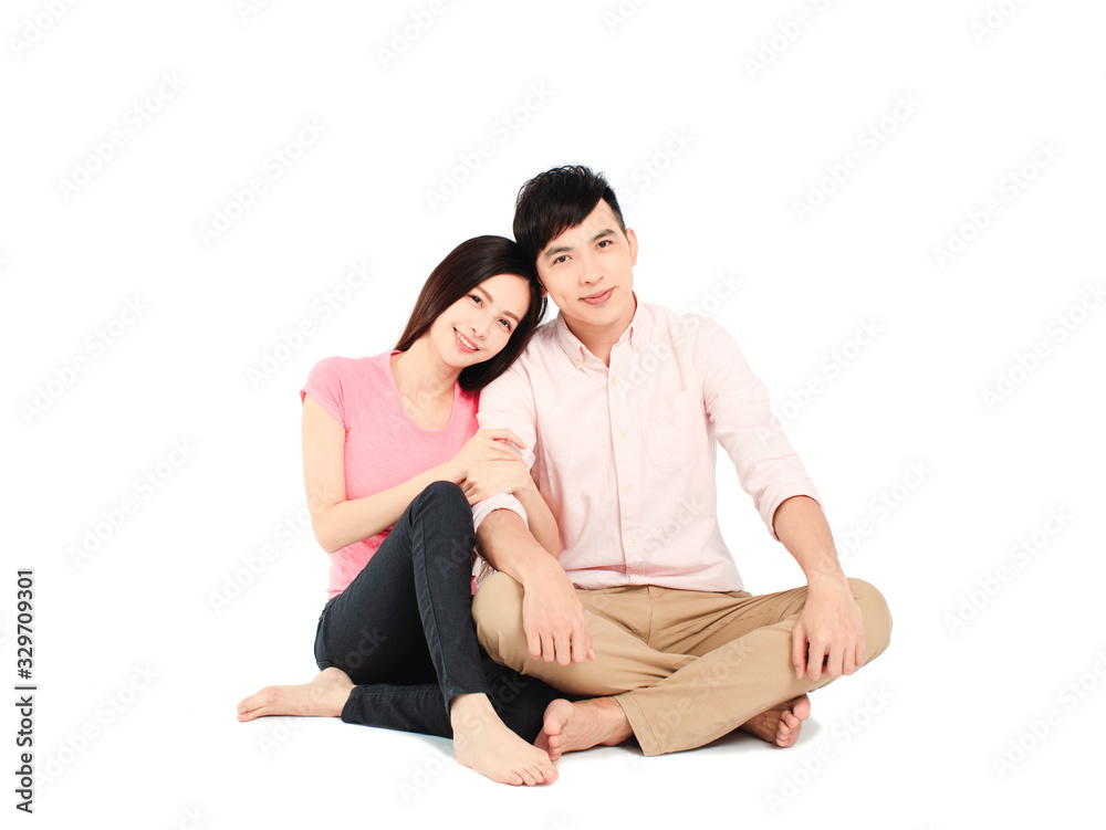 asian young couple sitting on floor isolated on white background asian young couple sitting on floor isolated on white background