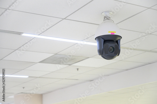 The surveillance camera setting on ceiling in the international airport of Bangkok, Thailand. Surveillance camera used for the purpose of observing an area.