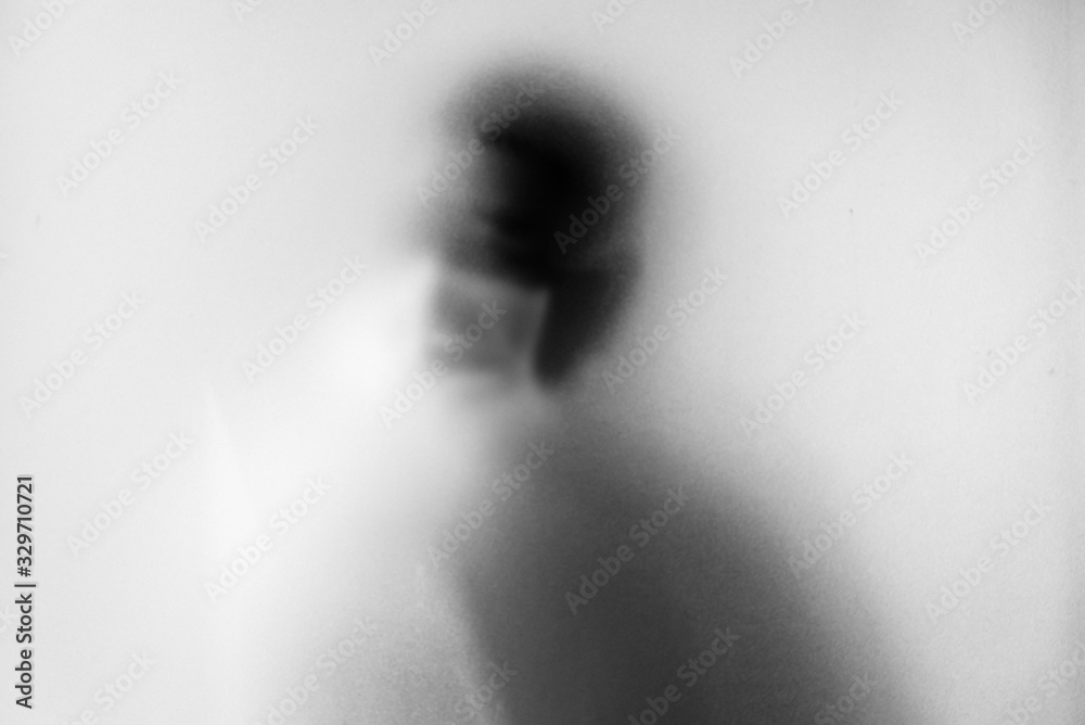 Shadow blur of man wear mask to prevent infection background.Fight against communicable diseases covid-19.Black and white picture.Blur picture.Fight deadly communicable diseases coronavirus.Soft focus Shadow blur of man wear mask to prevent infection background.Fight against communicable diseases covid-19.Black and white picture.Blur picture.Fight deadly communicable diseases coronavirus.Soft focus