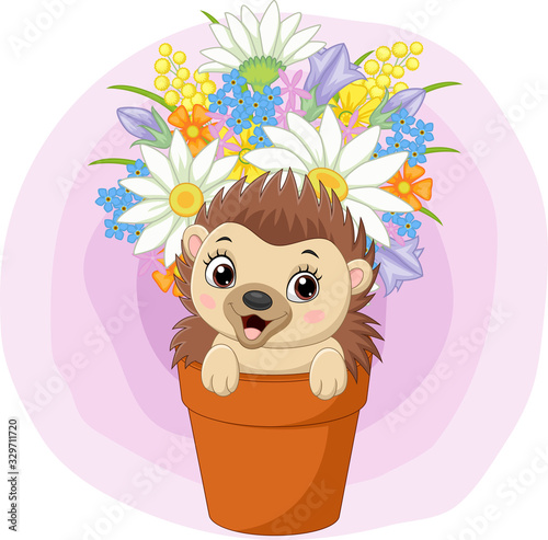 Cute baby hedgehog sitting in the plant pot