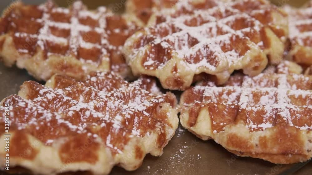 Waffles with powdered sugar on top, slow motion 1080p Waffles with powdered sugar on top, slow motion 1080p