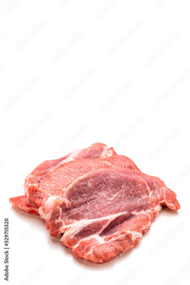 on a white background. piece of raw meat, pig neck