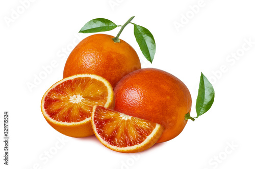Isolated orange fruit. Two whole red blood orange with leaves and slices isolated on white background