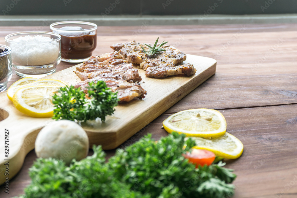 Close up grilled beef steak on wooden cutting board Close up grilled beef steak on wooden cutting board