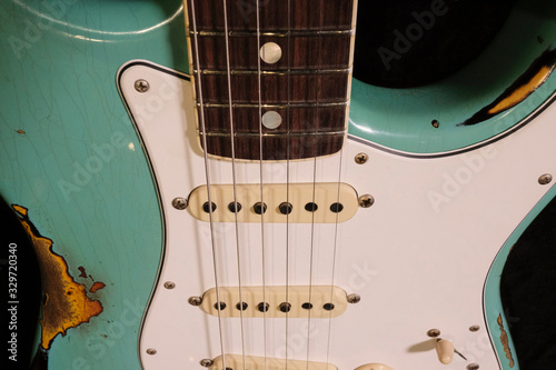 close up detail of electric guitar Body heavy Relic with selective focus.