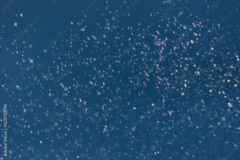 clear and fuzzy drops of water on a blue background - obrazy, fototapety, plakaty 