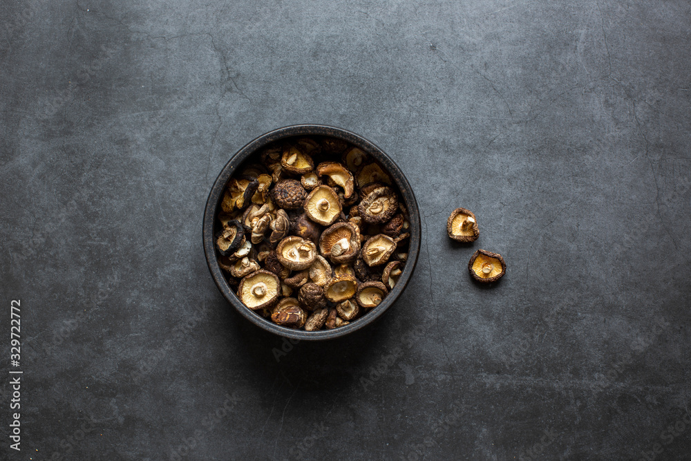 Dried Shiitake mushrooms on a dark background Dried Shiitake mushrooms on a dark background