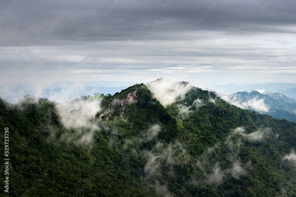 Beautiful view of clouds over the green mountain peak from Pha Tang view point in Chiang Rai, Thailand. Beautiful view of clouds over the green mountain peak from Pha Tang view point in Chiang Rai, Thailand.