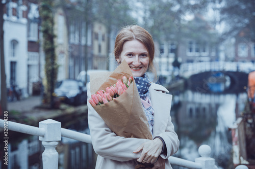 girl with tulips on a street of Amsterdam