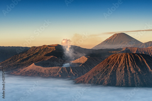 Beautiful view of Bromo, Batok and Semeru volcano with sea of fog at sunrise time in Java, Indonesia.