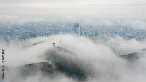 The scenery of the mist covered over Gifu city after raining in Gifu, Japan.