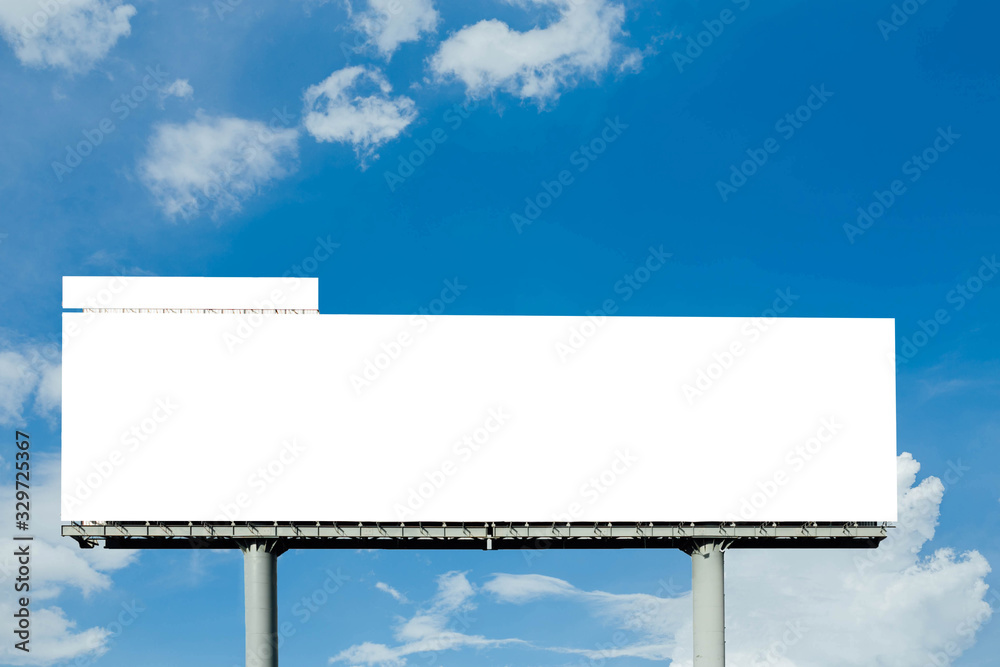 Fototapeta premium Blank billboard ready for new advertisement with blue sky background.