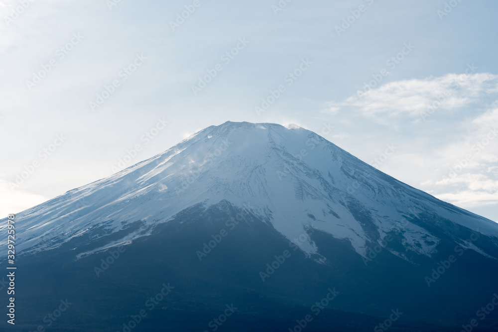 Closeup view of the peak of Fuji mountain covered with snow.