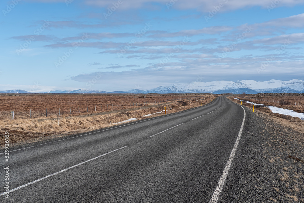 Empty long road to the mountains