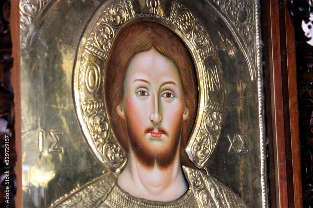 Icon of Jesus Christ handcrafted and covered with gold inside a Christian orthodox church in Athens, Greece