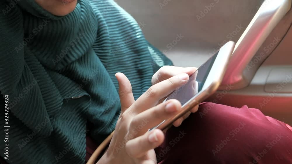 Close up of women use smart phone in a car