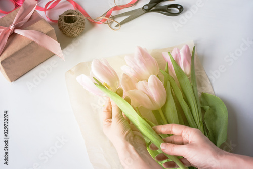 Fototapeta Naklejka Na Ścianę i Meble -  The orange bouquet of tulips is pink.
