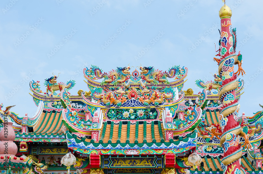 Chinese Shrine Decorate with Colorful Ornament Art on Rooftop and Building.