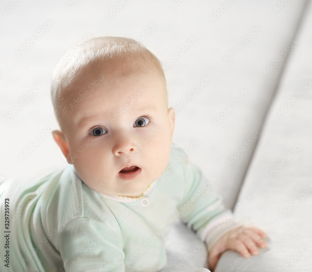 close-up of a pretty little baby looking at the camera.photo wit