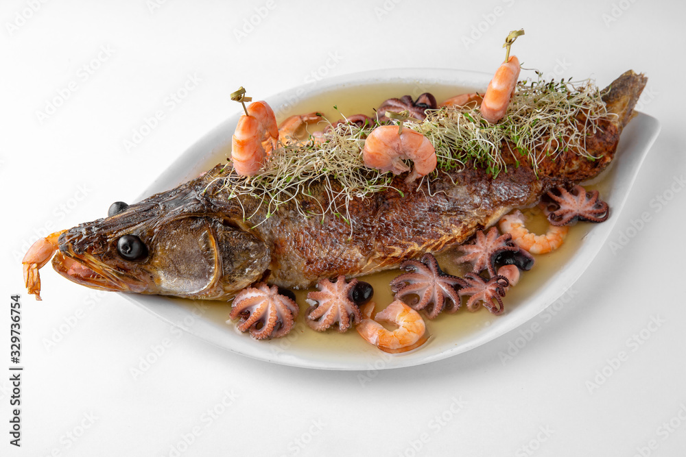 Jellied fish with seafood. Banquet festive dishes. Gourmet restaurant menu. White background.