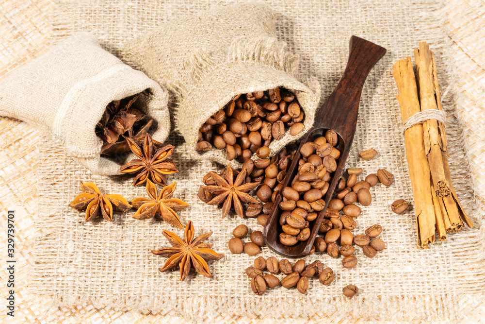 roasted coffee beans with cloth sack on wooden texture roasted coffee beans with cloth sack on wooden texture