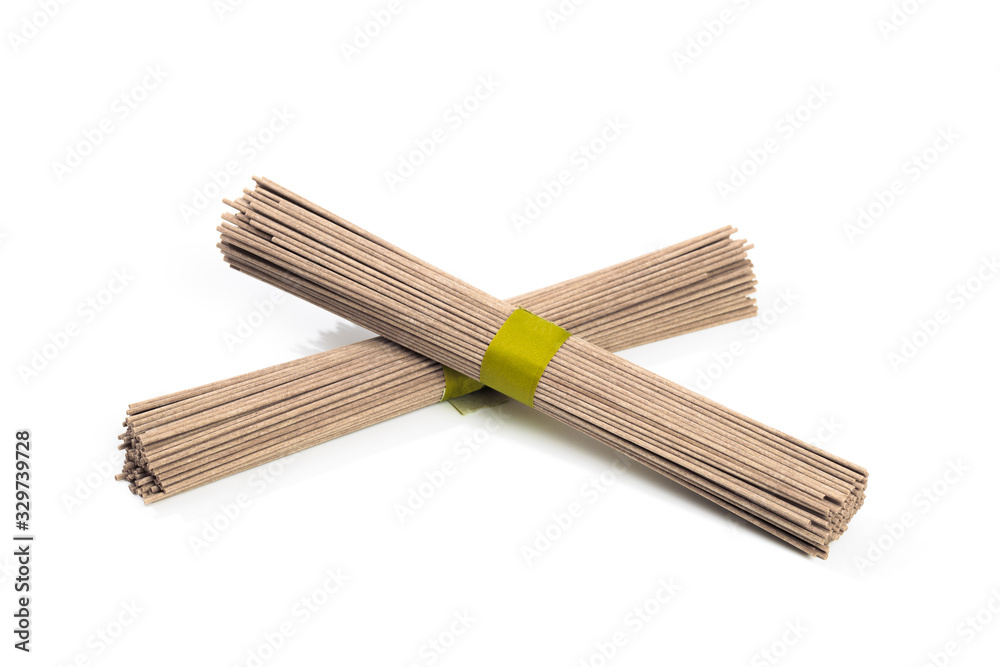 Dried raw japanese soba noodle sticks isolated on a white background. - Image Dried raw japanese soba noodle sticks isolated on a white background. - Image