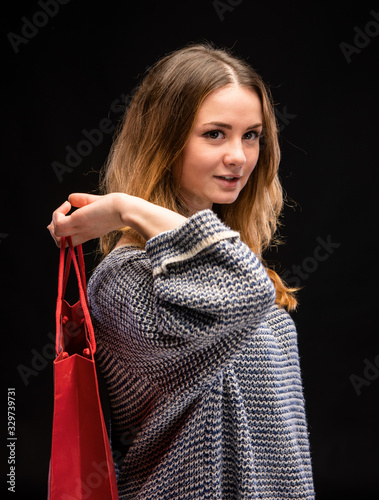 Young happy woman with shopping bag
