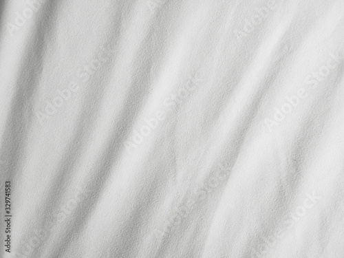 Soft white wrinkled fabric background