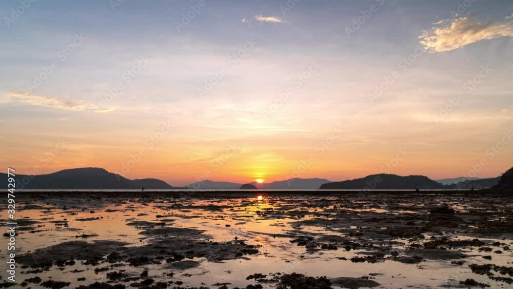 Time lapse video Scene of Colorful sunset with Moving clouds with reflection at low tide levels in nature and travel concept wide angle shot Panorama shot in Apple Proress 422(HQ)4096x2304 resolution. Time lapse video Scene of Colorful sunset with Moving clouds with reflection at low tide levels in nature and travel concept wide angle shot Panorama shot in Apple Proress 422(HQ)4096x2304 resolution.
