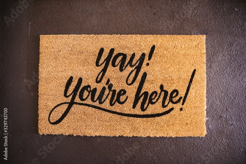 High angle shot of a foot rug with a text 