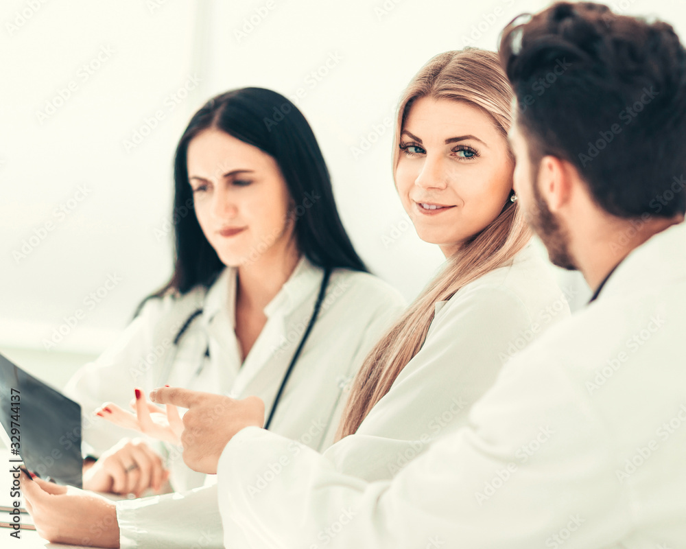 doctor radiologist discussing x-ray with her colleagues. doctor radiologist discussing x-ray with her colleagues.