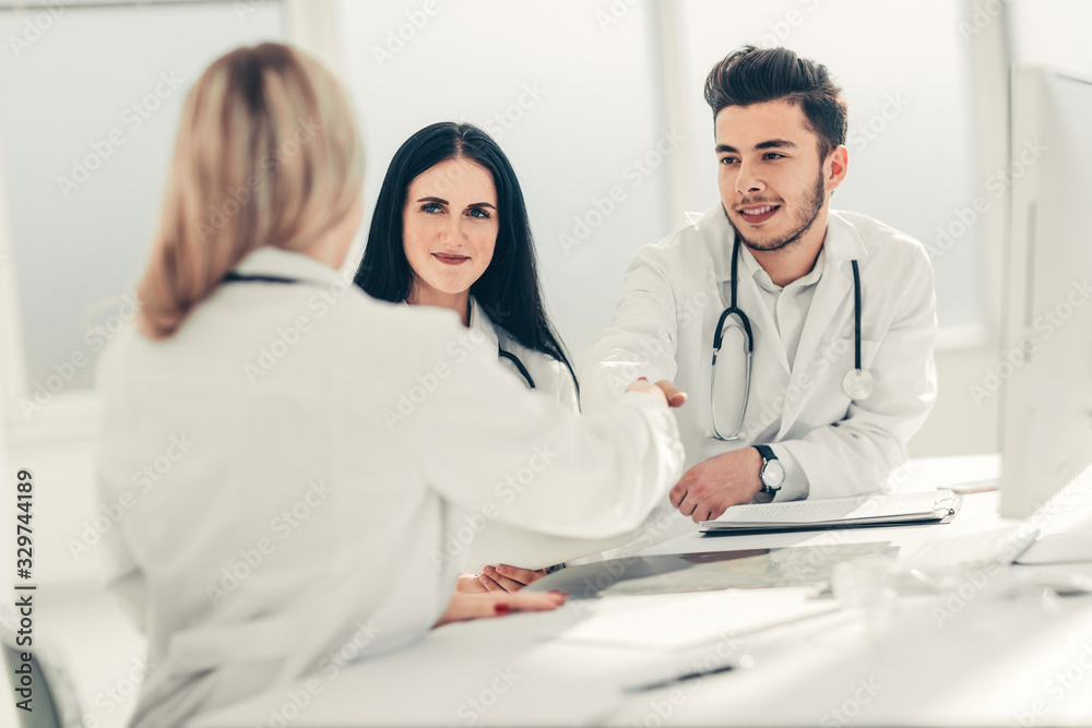 Fototapeta premium handshake of medical doctors at the Desk .