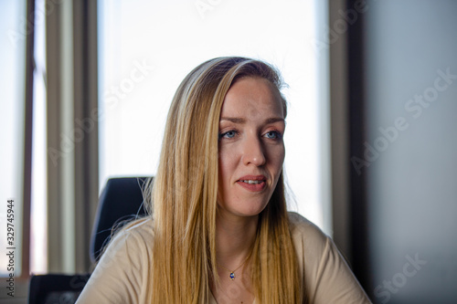 Close up portrait of blonde female with blue eyes