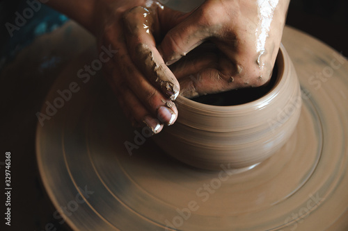 Female hands working with loam, close up. Profession pottery concept.