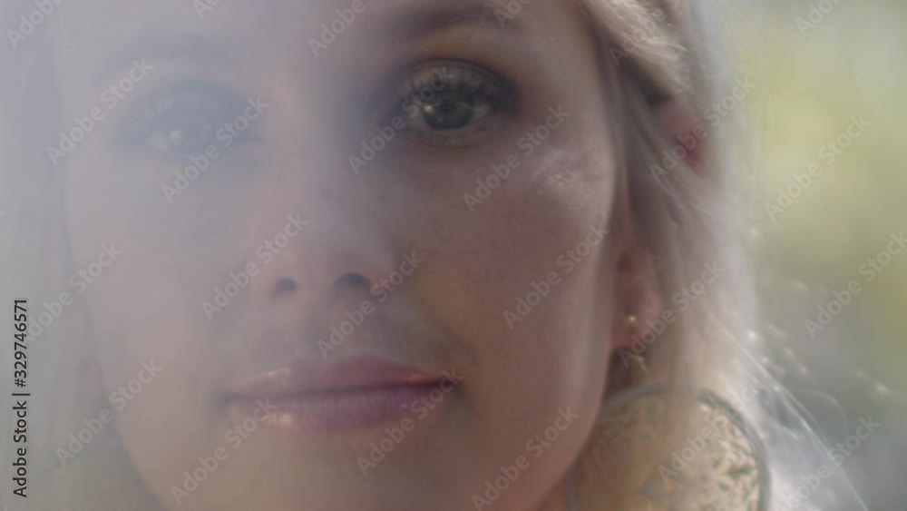 Beautiful Blond Woman Looking At Camera In Sunlight