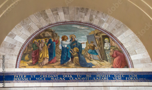 Bethany, Betania, Israel January 31, 2020: Church in Bethany in commemorating the home of Mari, Martha and Lazarus, Jesus' friends as well as the tomb of Lazarus.  Colorful mosaic in the church photo