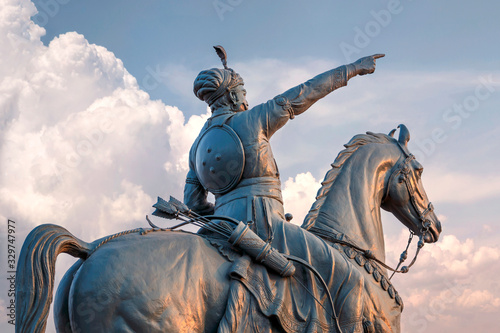 Rao Jodha statue and Mehrangarh Fort in Jodhpur, India photo