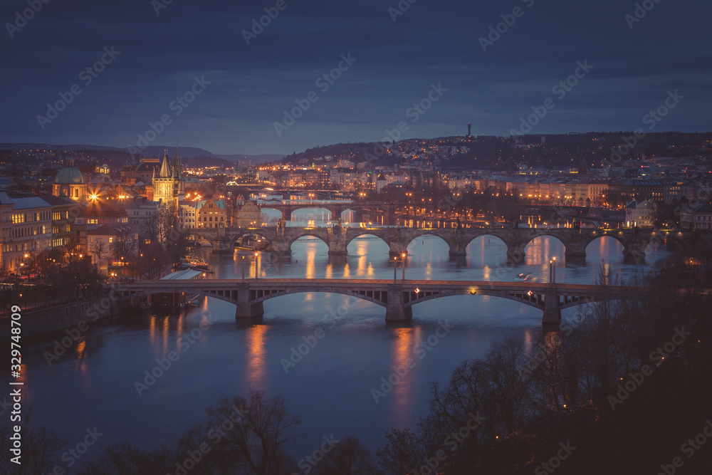 Moody evening in Prague. Seven bridges on Vltava river view from Letna Hill