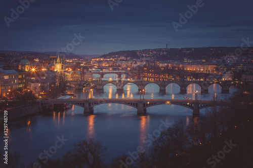 Moody evening in Prague. Seven bridges on Vltava river view from Letna Hill
