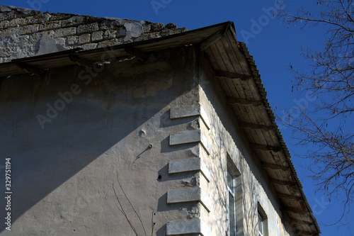 corner of an old stone house with architectural accents