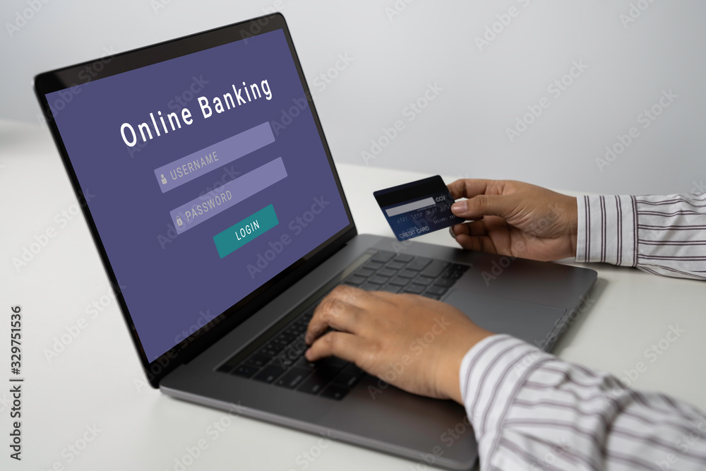 Person using online banking with credit card on touch screen device. Internet online banking. Digital and internet payments shopping on network. All on screen and credit card are designed up. Person using online banking with credit card on touch screen device. Internet online banking. Digital and internet payments shopping on network. All on screen and credit card are designed up.