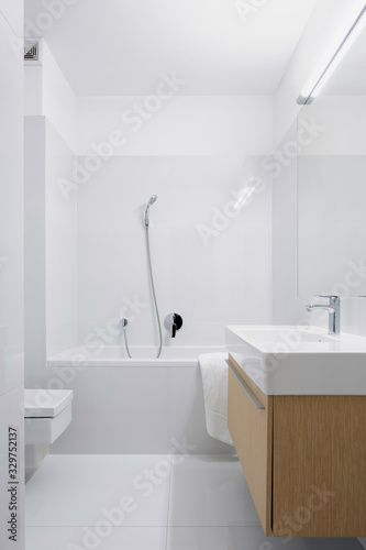 Bathroom in white and grey tiles