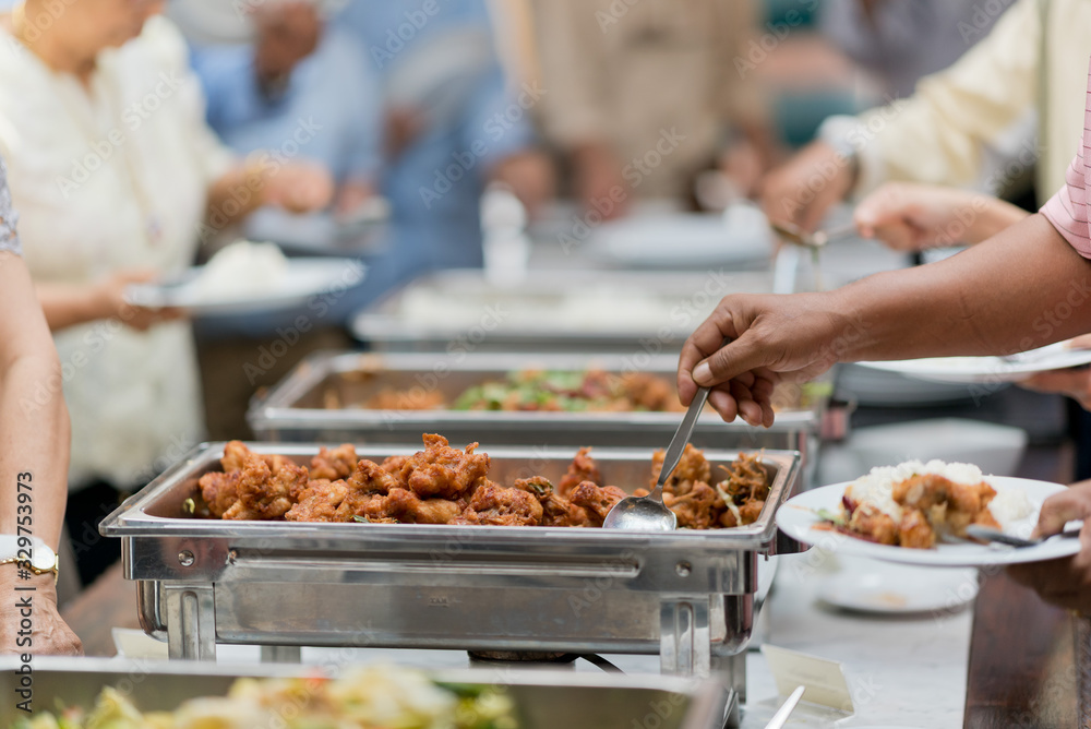 scooping the food, catering, dinner time